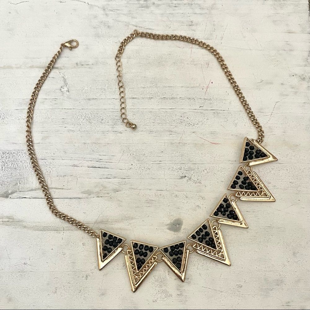 Gold tone black beaded triangle necklace